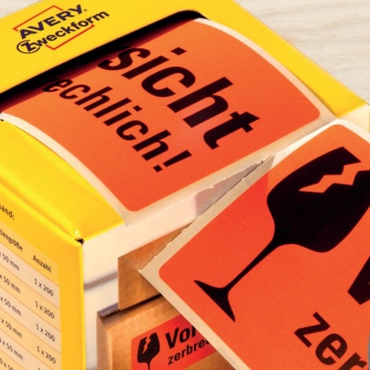 Warnetiketten auf Rolle mit Perforation