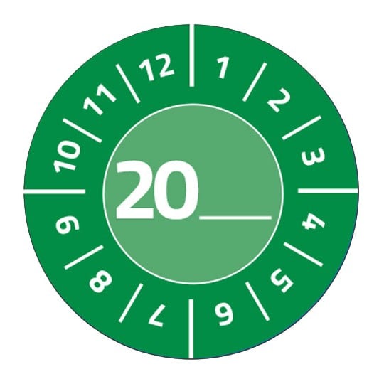 Eine grüne Prüfplakette, kreisrund stehen die Zahlen 1 bis 12. In der Mitte steht 20 und man kann selbst die Jahreszahl eintragen.