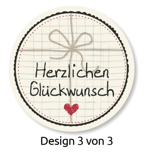Das Bild zeigt ein kreisförmiges Design mit einem Rasterhintergrund, eine Schleife aus Schnur und den Text 'Herzlichen Glückwunsch'. Es enthält auch ein kleines Herz und gibt an 'Design 3 von 3'.