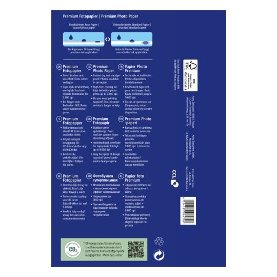 Das Bild zeigt die Verpackung für Premium-Fotopapier, das in mehreren Sprachen Informationen über seine Qualität, seine schmierfesten Eigenschaften und die High-Tech-Beschichtung für hochauflösende Drucke bis zu 9.600 dpi enthält.