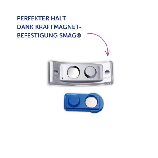 Das Bild zeigt zwei Gegenstände, einen metallischen und einen blauen, beide wahrscheinlich magnetische Befestigungen. Der Text lautet 'PERFEKTER HALT DANK KRAFTMAGNET-BEFESTIGUNG SMAG®'.