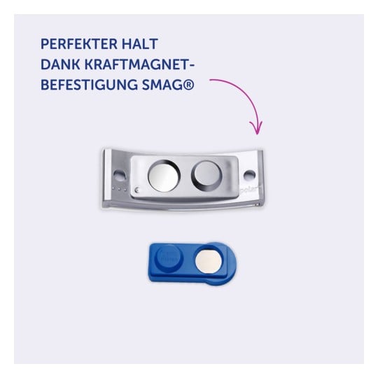 Das Bild zeigt ein Metallteil und ein blaues Kunststoffteil, das als magnetisches Befestigungssystem bezeichnet wird. Der Text gibt an, dass es durch die Kraftmagnetbefestigung SMAG® perfekten Halt bietet.