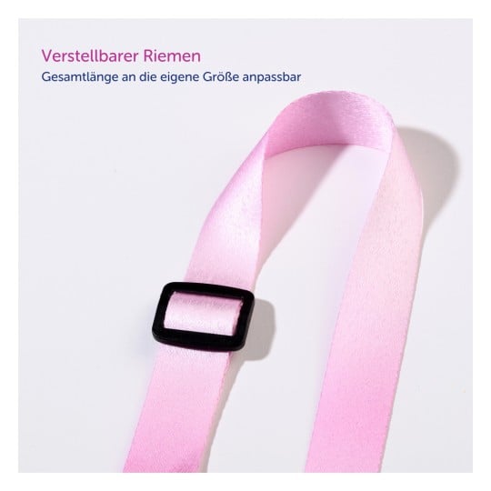 Das Bild zeigt einen rosa verstellbaren Riemen mit einer schwarzen Schnalle. Der Riemen wirkt glatt und liegt vor einem hellen Hintergrund, begleitet von deutschem Text, der darauf hinweist, dass er in der Länge verstellbar ist.