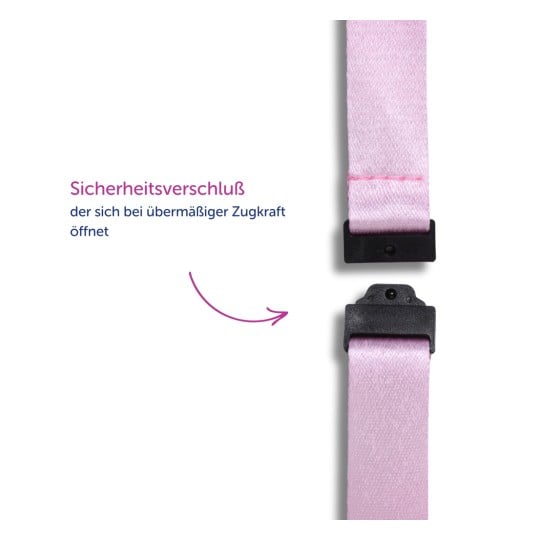 Das Bild zeigt einen Sicherheitsgurt in Pink mit schwarzen Verschlüssen, begleitet von einem Text, der erklärt, dass er sich bei übermäßigem Zug öffnet.
