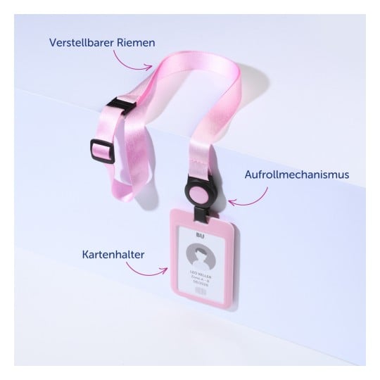 Das Bild zeigt einen rosa Ausweishalter mit einem verstellbaren Band und einem Aufrollmechanismus. Der Ausweis zeigt einen Namen und ein Datum.