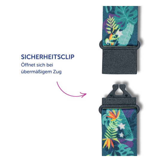 Das Bild zeigt einen Sicherheitsclip. Es enthält einen deutschen Text, der angibt, dass er sich bei übermäßiger Belastung öffnet. Der Clip ist an einem bunten Band mit Blumen- und Blättermustern befestigt.
