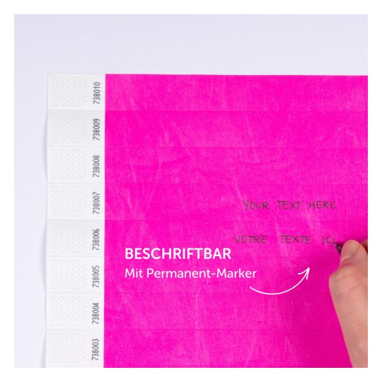 Das Bild zeigt eine leuchtend pinkfarbene Oberfläche mit handschriftlichem Text und Beschriftungen, die darauf hinweisen, dass sie mit einem Permanentmarker gekennzeichnet werden kann.