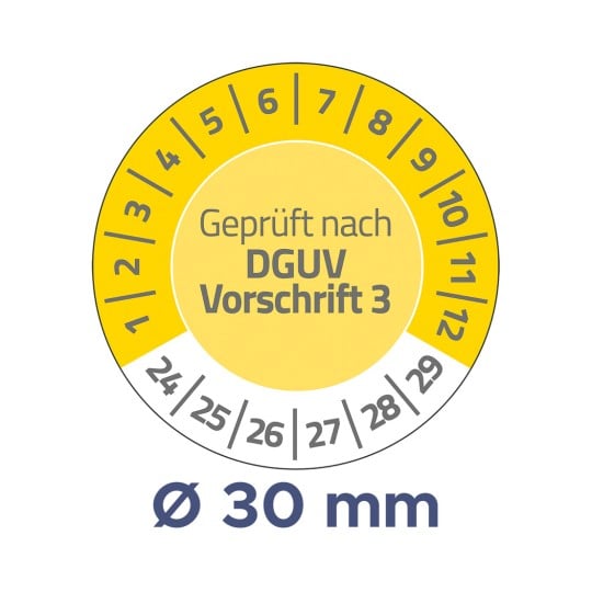 Das Bild zeigt ein gelbes, rundes Messgerät mit der Aufschrift „Geprüft nach DGUV Vorschrift 3“ und Zahlen am Rand, die Dimensionen anzeigen, sowie eine Messung von „Ø 30 mm“ am unteren Rand.