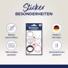 Das Bild zeigt ein Set dekorativer Aufkleber mit verschiedenen Designs, darunter Herzen und Rahmen. Es hebt ihre Merkmale hervor, wie z.B. beschreibbar mit Markern, mikrowellengeeignet und spülmaschinenfest. Das Produkt wird in Deutschland hergestellt.