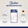 Das Bild zeigt ein Set von Design-Aufklebern, die mit Markern beschreibbar, mikrowellengeeignet und spülmaschinenfest sind. Es wird hervorgehoben, dass die Aufkleber in Deutschland hergestellt werden.