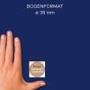 Größenvergleich mit Hand, Artikel: 56814, ein Bogen Sticker auf Rolle, Format: ⌀ 38 mm, Farbe: Bunt