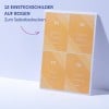Das Bild zeigt ein gedrucktes Blatt mit 12 Namenskarten, die angepasst werden können. Die Namen sind Mélina Dopper (Fotografin), Claude Marite (Projektleiter), Ernie Mapp (Designer) und Coralie M iaping (Grafikerin), alle in einem orangefarbenen Farbschema dargestellt.