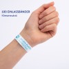 Das Bild zeigt eine Hand, die ein weißes Armband trägt, das mit dem Text '100 EINLASSBÄNDER' und 'JULIEN PLATTER MARKETING' beschriftet ist. Das Armband wird als klimaneutral beschrieben.