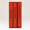 The image features three red binders labeled 'BUDGET', 'MEETINGS', and 'MARKETING'. They are arranged vertically against a light background.