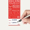 Ein Bestellanhänger mit verschiedenen Sprachen, auf dem 'Guten Appetit!' steht, sowie einem handgeschriebenen Namen 'Laura' und der Bestellnummer 'AVE06'.