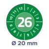 Das Bild zeigt ein rundes Zifferblatt, das mit den Zahlen von 1 bis 12 markiert ist, mit der Zahl 26 auffällig in der Mitte. Unter dem Zifferblatt befindet sich eine Angabe, die einen Durchmesser von 20 mm angibt, vor einem grünen Hintergrund.